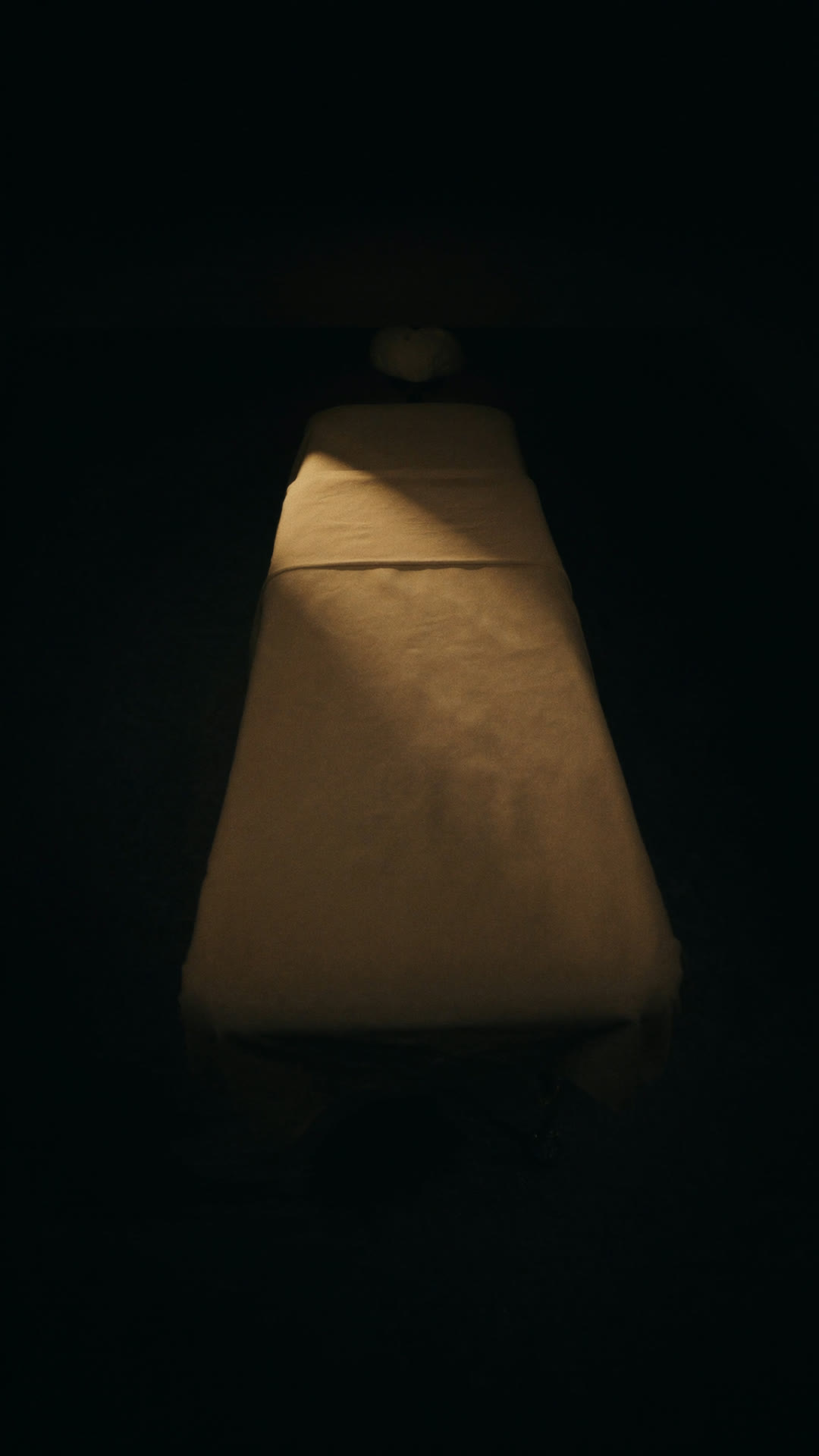 The treatment table set with warm light at The Healing Bench